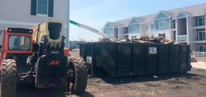 Cumberland Services roll-off container on subdivision construction site.